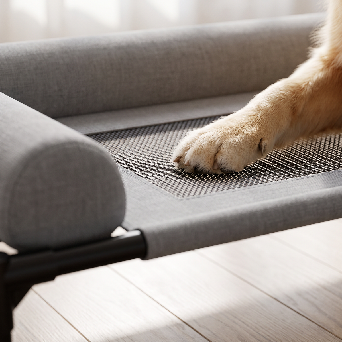 Close up of the breathable mesh and bolster pillow on the Breeze cooling cot