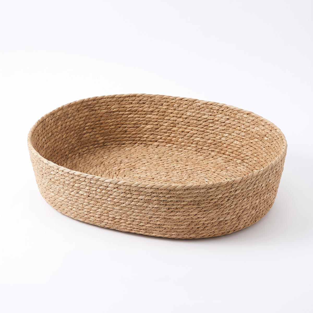 Nook woven oval pet basket bed on white background